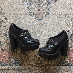 Black platform pumps